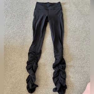 LuluLemon size 4 leggings with ruching detail on the sides of the calf!